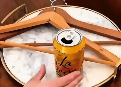 Double Your Hanger Space With a Can Tab